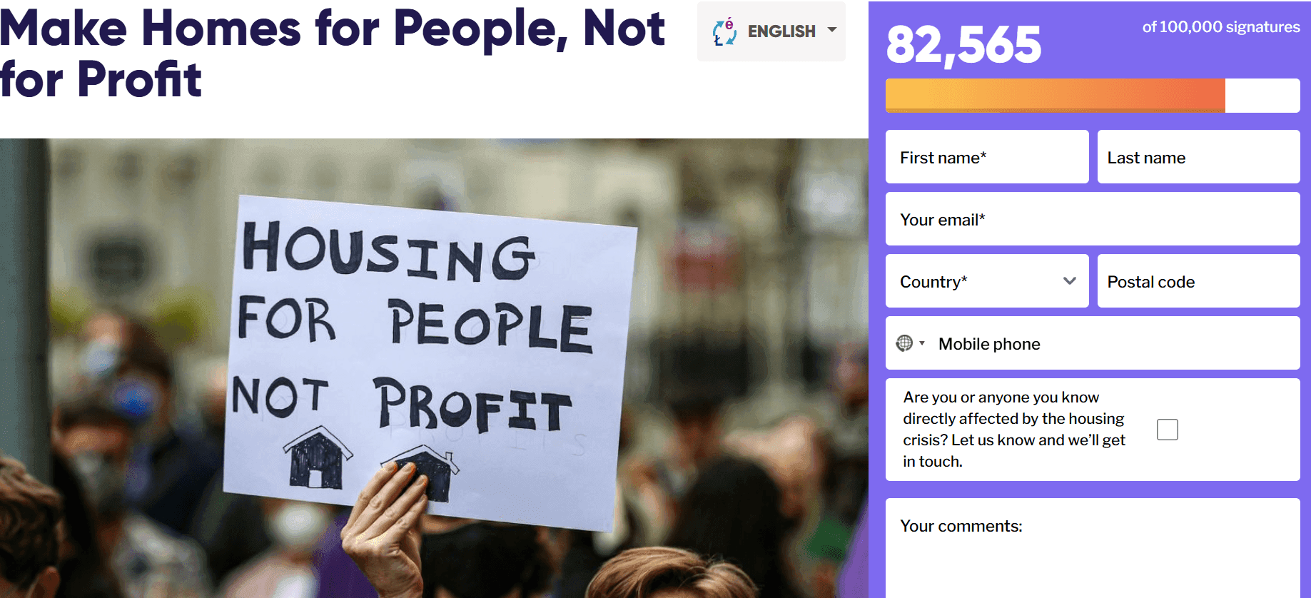 Picture of a lady holding a sign to protest against the housing crisis